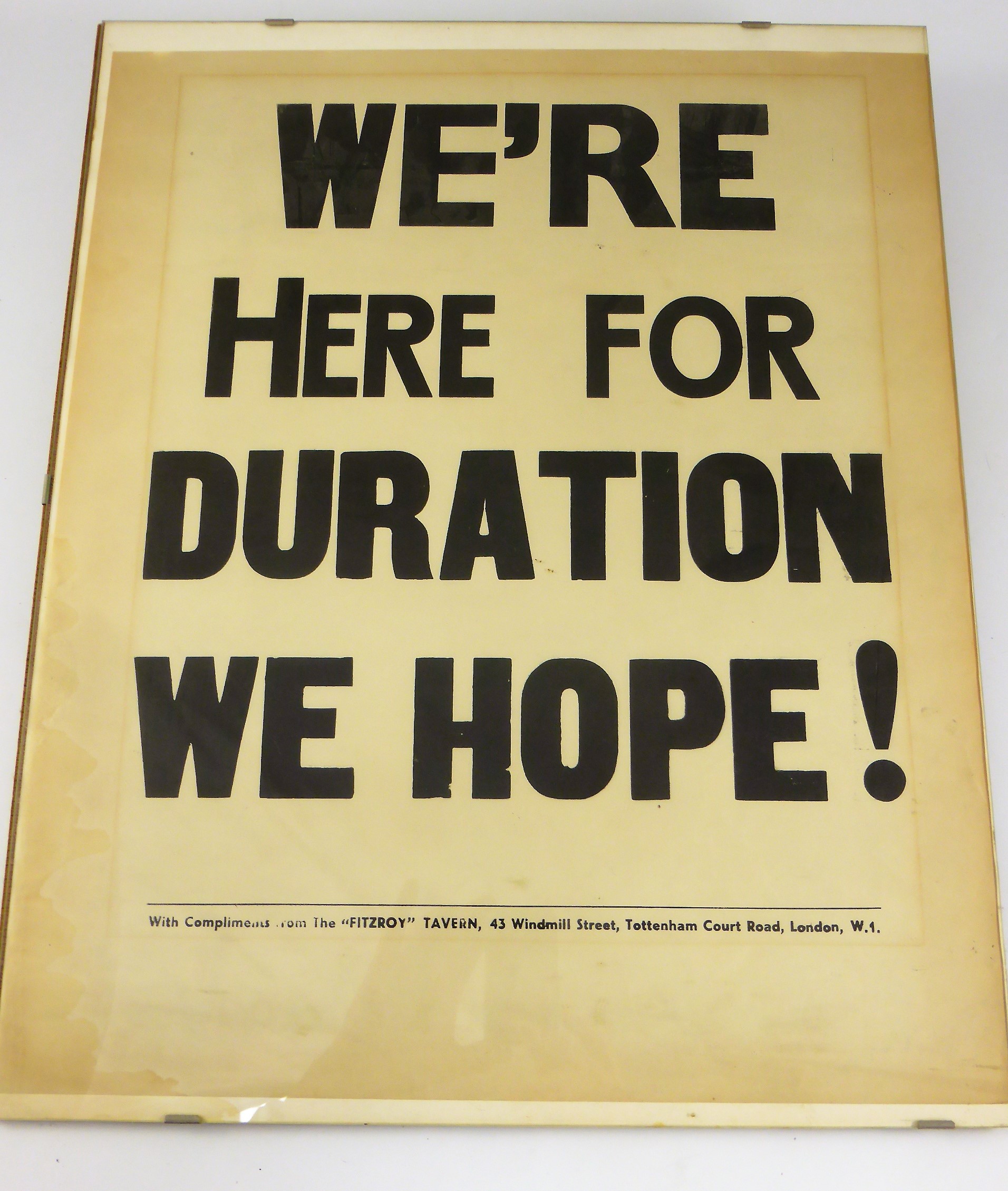 POSSIBLY WARTIME ERA POSTER 'WE ARE HERE FOR THE DURATION WE HOPE' FITZROY TAVERN, 43 WINDMILL
