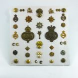 MILITARIA, A DISPLAY OF MILITARY INSIGNIA TO THE WELSH FOOTGUARDS, GRENADIER, COLDSTREAM, IRISH,