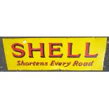 ENAMEL ADVERTISING SIGN SHELL SHORTENS EVERY ROAD APPROX 54 INS X 18 INS.