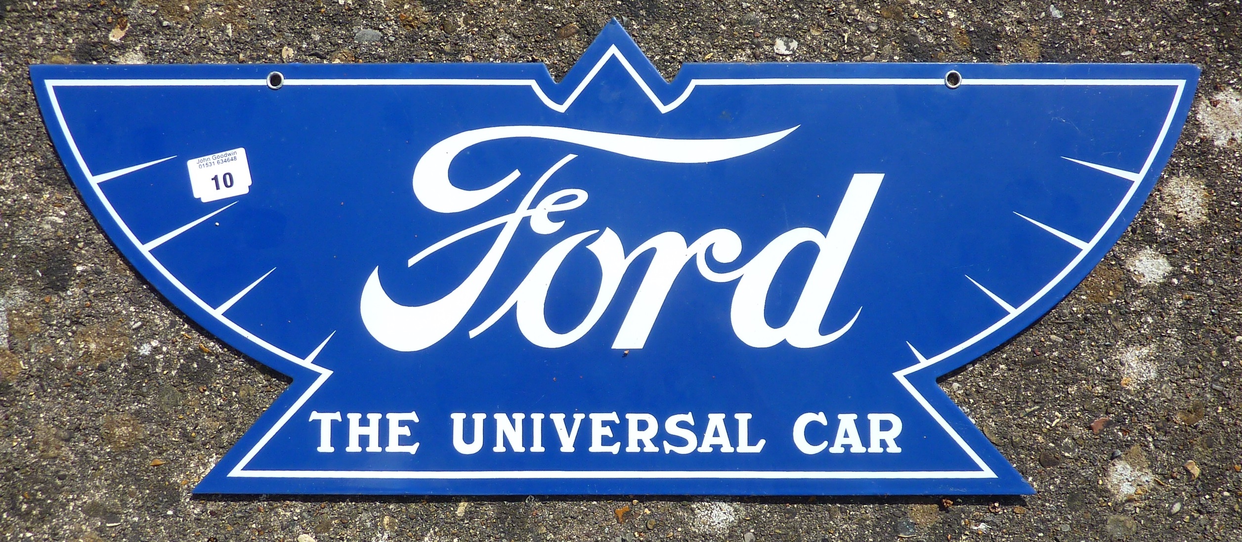 FORD THE UNIVERSAL CAR DOUBLE SIDED ADVERTISING SIGN APPROX 30 INS. X 17 INS.