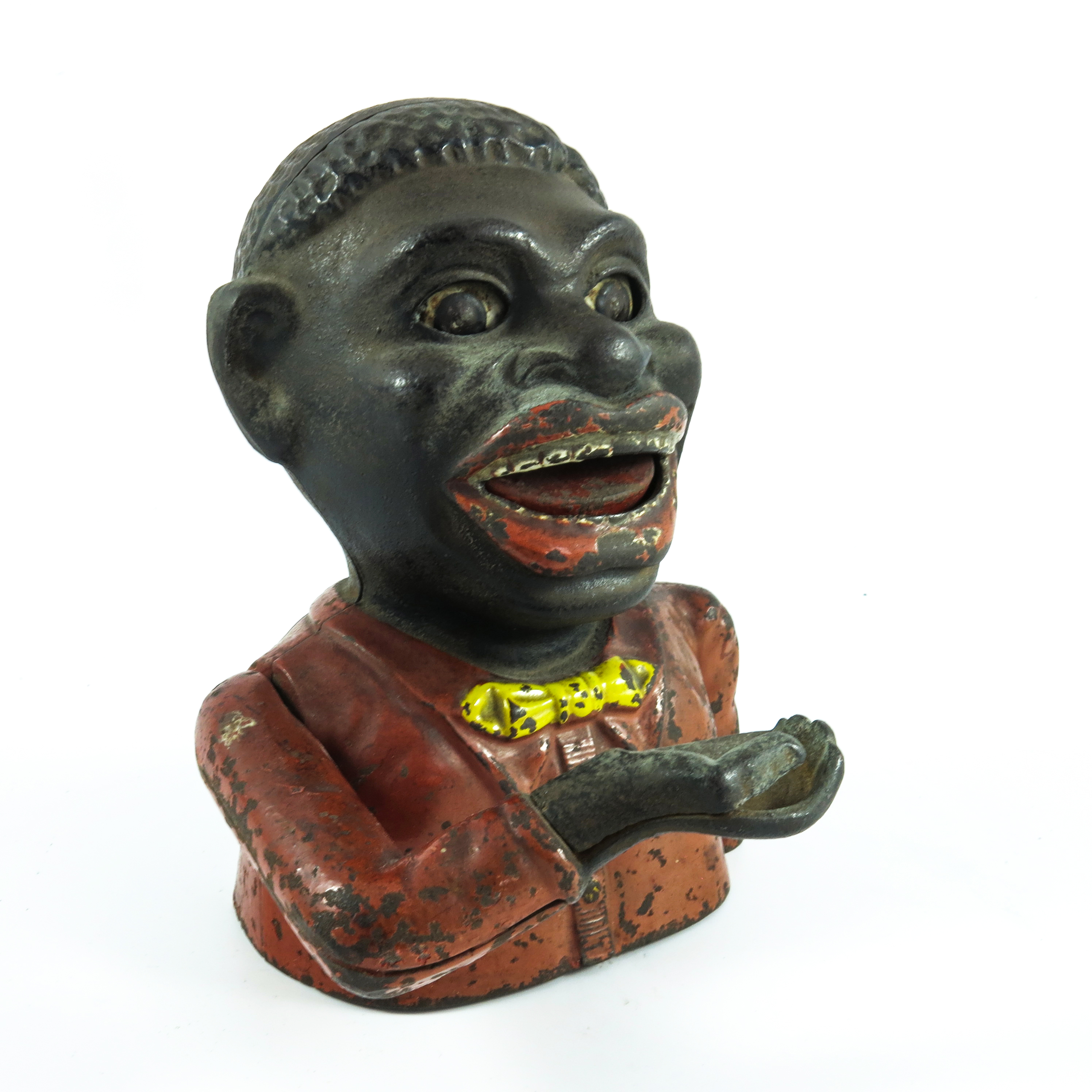 'JOLLY NIGGER' ORIGINAL CAST IRON MECHANICAL MONEY BOX, RED POLYCHROME DECORATION WITH YELLOW BOW