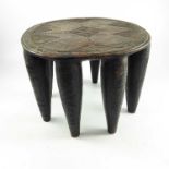 AFRICAN, POSSIBLY NUPE, CARVED 8 LEGGED STOOL WITH GEOMETRIC DECORATION, APPROX. 40 X 37 cm