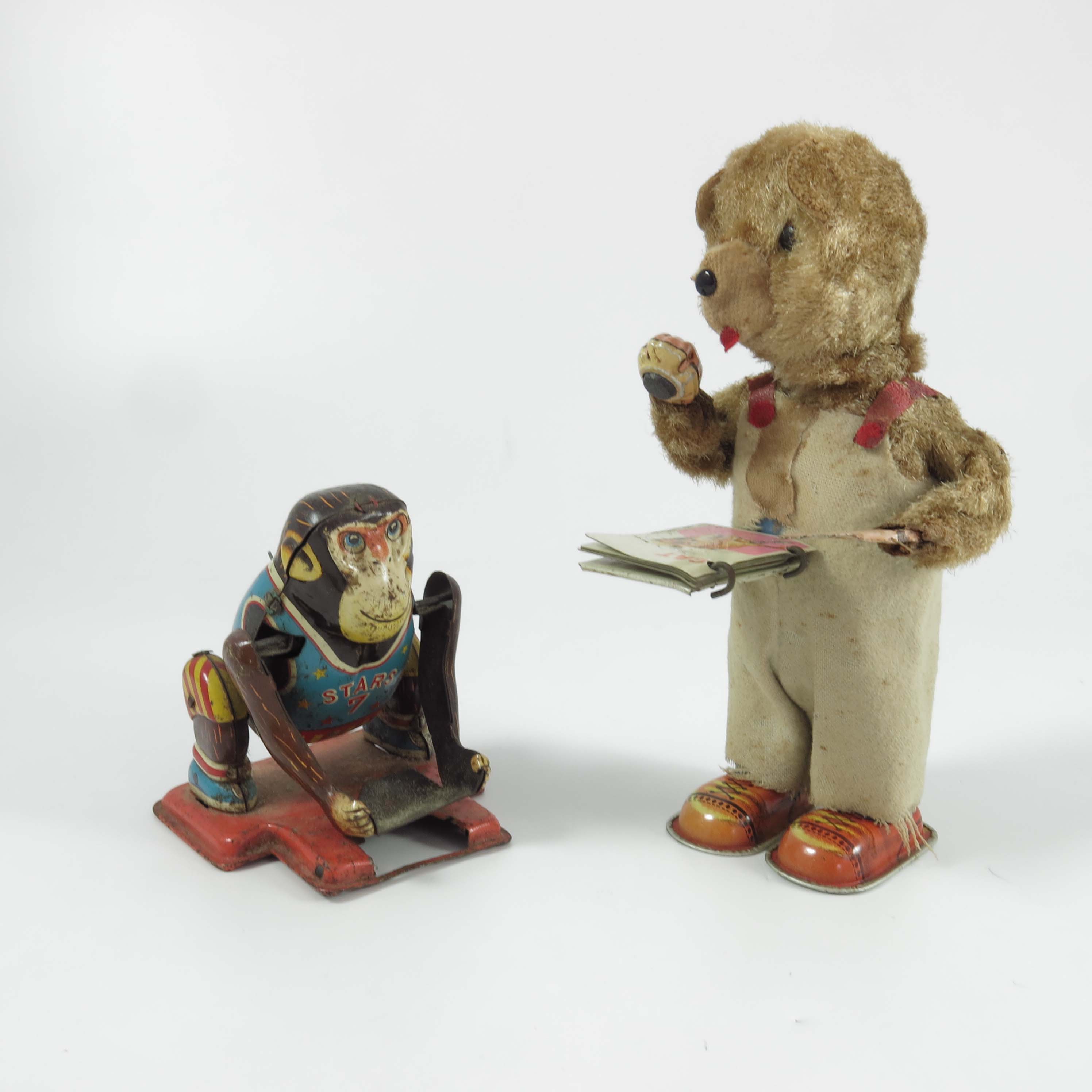 CLOCKWORK, TIN PLATE, AMERICAN FOOTBALL MONKEY, TPS MADE IN JAPAN, AND A CLOCKWORK BEAR WITH A BOOK