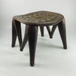 AFRICAN, POSSIBLY NUPE, CARVED 4 LEGGED STOOL WITH GEOMETRIC DECORATION AND CARVED SUPPORTS, APPROX.