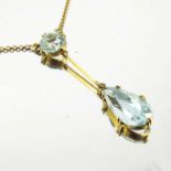 AQUAMARINE OR BLUE TOURMALINE NECKLACE ON GOLD CHAIN WITH ROUND STONE BAR DROPPER AND TEAR DROP