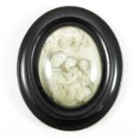 LATE 19TH CENTURY HIGH RELIEF OVAL SHAPED PANEL DEPICTING VIRGIN AND CHILD, IN FRAME, PANEL