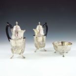 SILVER CHOCOLATE SET COMPRISING 2 CHOCOLATE POTS WITH REPOUSSE SWAG AND BOW DECORATION RAISED ON 3