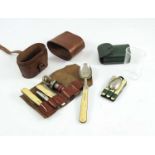 A GENTLEMAN'S LEATHER CASED CAMPAIGN SET WITH ROLL CONTAINING BONE HANDLED, FOLDING, KNIFE, FORK AND