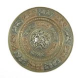 PERSIAN CIRCULAR PLAQUE WITH RELIEF DECORATION, PANELS DEPICTING BIRDS AND A CENTRAL CIRCULAR