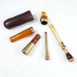 9CT GOLD, AMBER AND IVORY CIGARETTE HOLDERS