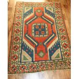 TURKISH RUG, APPROX. 237 X 162 cm, GEOMETRIC DESIGNS ON AN ORANGE GROUND