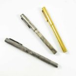 3 DUNHILL FOUNTAIN PENS, GOLD AND SILVER COLOURED, EACH WITH A NIB MARKED 585