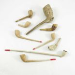 CLAY PIPES INC. ONE WITH FOOTBALL RELIEF DECORATION