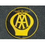 A LARGE 18 INS. IN DIAMETER CIRCULAR AA BLACK & YELLOW ADVERTISING SIGN