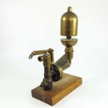 BRASS STEAM TRAIN WHISTLE MOUNTED FOR DISPLAY ON A WOODEN PLINTH