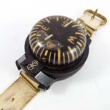 WWII ERA WRIST WORN MILITARY COMPASS, LIQUID FILLED WITH CANVAS WEBBING STRAP