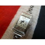 LADIES 1920’S SILVER DRESS WATCH BY GRUEN, SILVER STRAP WITH MARCASITE INSETS