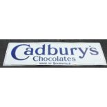 ENAMELLED SIGN 60 INS. X 18 INS. CADBURY CHOCOLATES MADE IN BOURNVILLE