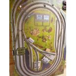 MODEL RAILWAY LAYOUT BASE BOARD APPROX. 6 FEET X 4 FEET, WITH GOOD SELECTION OF TRACK AND 10