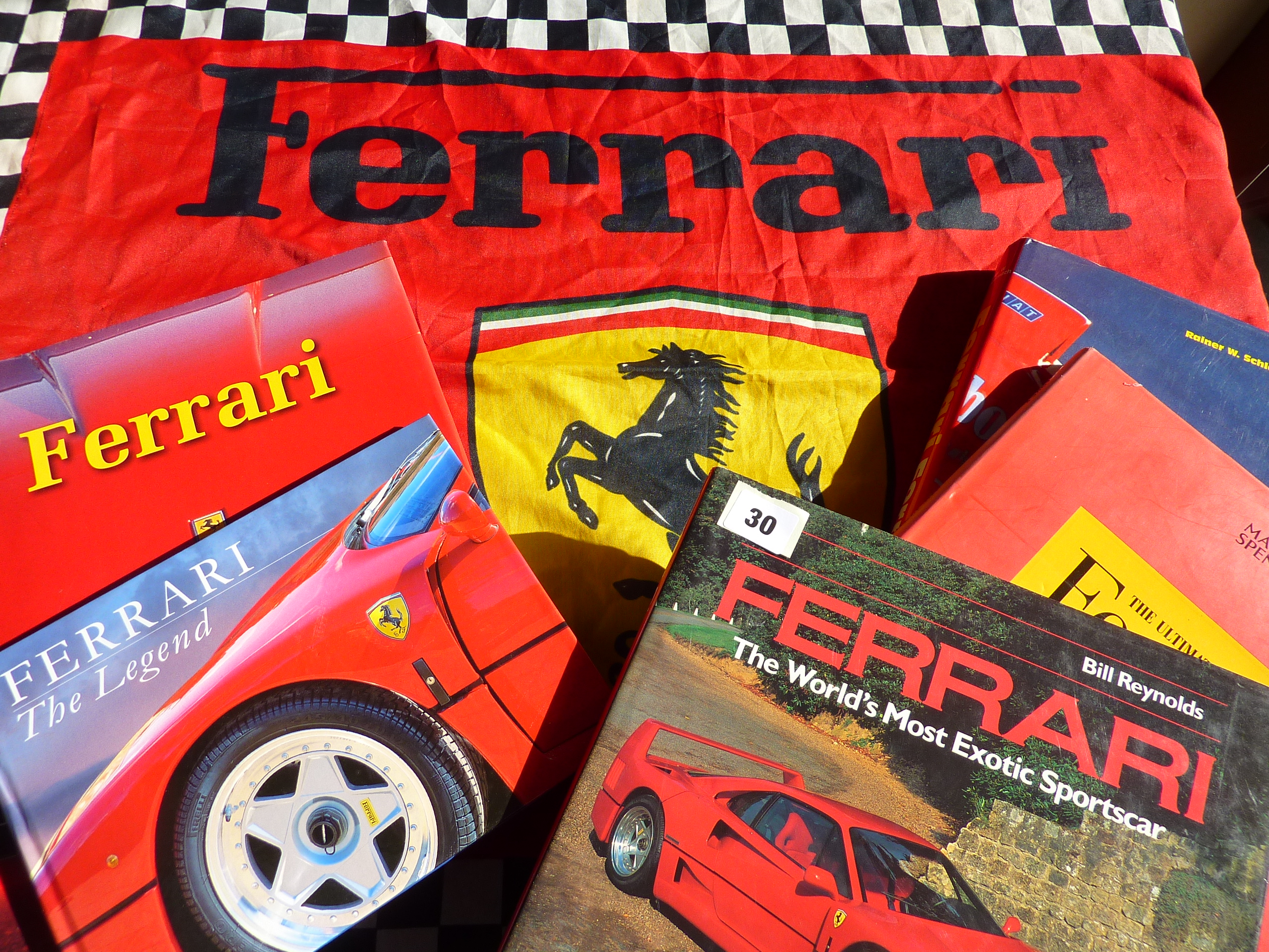 MOTORING INTEREST A FERRARI FLAG AND 7 GOOD BOOKS ON FERRARI CARS