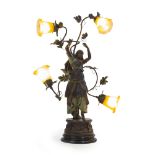 A patinated metal figural light