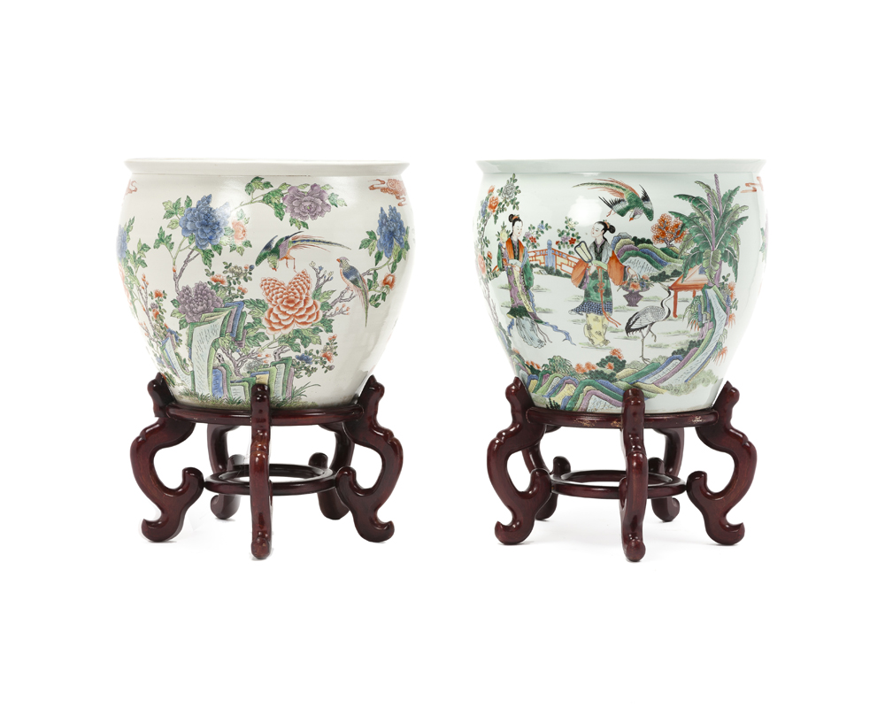 A near pair of Chinese fish bowls on stands