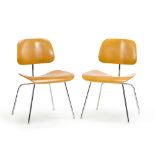 A pair of Eames-style chairs