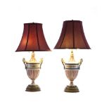 A pair of German urn-form lamps
