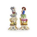 Two porcelain figural candlesticks