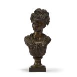 A bronze bust of a woman