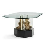 A glass dining table with figural Buddha base
