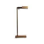 A vintage brass and wood floor lamp