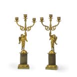 A pair of bronze candelabra