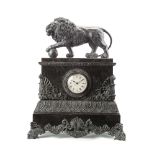 A patinated metal and marble mantel clock