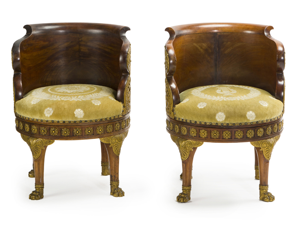 A pair of French Empire mahogany and gilt bronze-mounted fauteuils de bureau