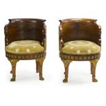 A pair of French Empire mahogany and gilt bronze-mounted fauteuils de bureau