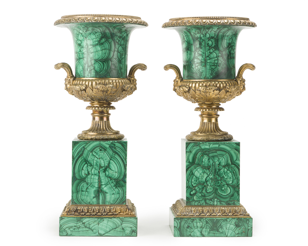 A pair of malachite-veneered urns