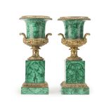 A pair of malachite-veneered urns