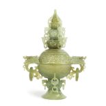 A jade carved and reticulated standing urn