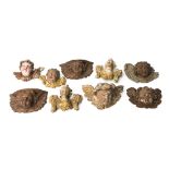 Nine German carved wood cherub heads