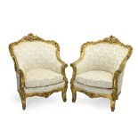 A pair of Louis XV-style carved and giltwood bergères