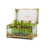 A Hollywood Regency-style glass tantalus set