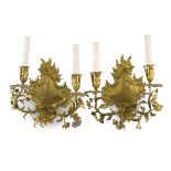 A pair of gilt-bronze French Louis XV-style wall sconces