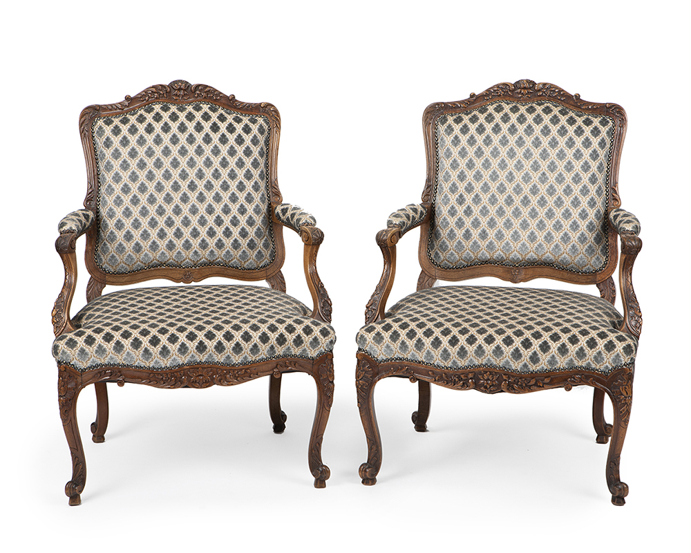 A pair of French Provincial-style armchairs