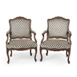 A pair of French Provincial-style armchairs