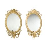 A pair of giltwood three-light mirrors