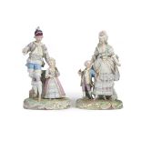 A pair of German porcelain figural groups