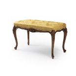 A French Louis XV-style carved wood window bench