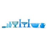 A group of sky-blue glass table and vanity items