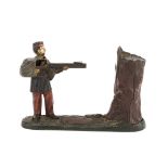 A cast iron Creedmoor mechanical coin bank